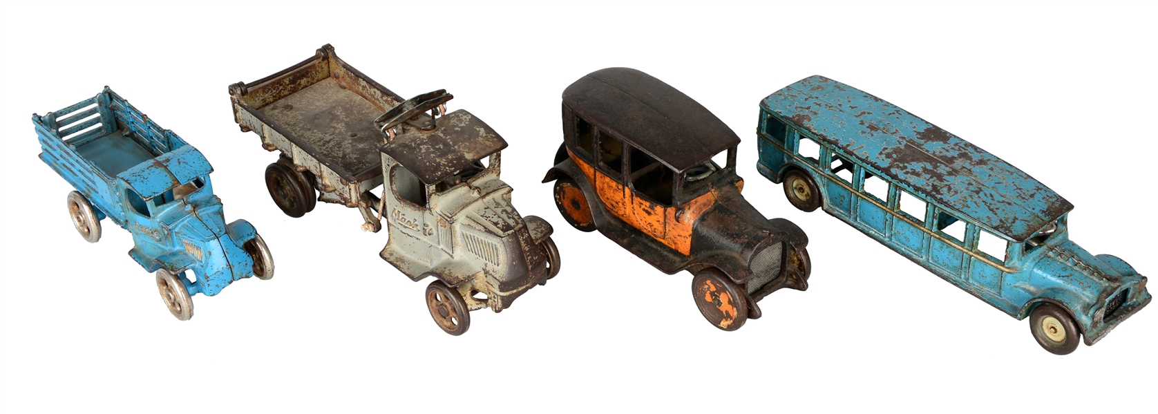 LOT OF 4: CAST IRON TRUCK, CAR, AND BUS TOYS.
