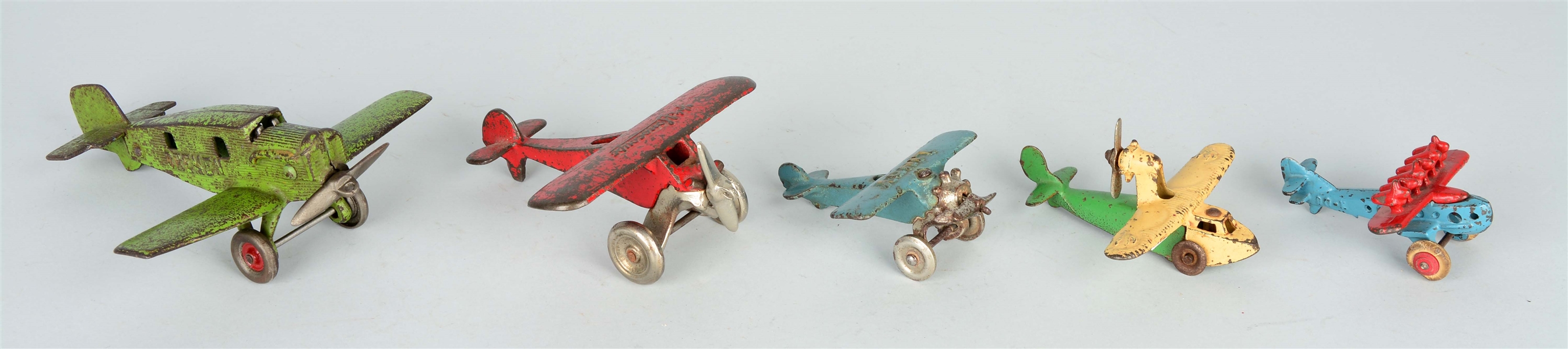 LOT OF 5: CAST IRON TOY AIRPLANES.