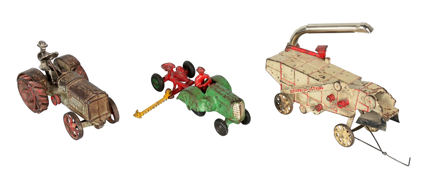 LOT OF 3: PAINTED CAST IRON TRACTORS. 