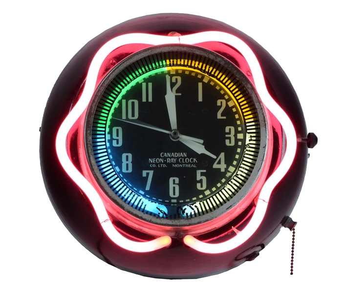CANADIAN NEON RAY GLASS FACE SPINNER CLOCK.