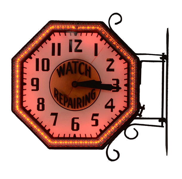 ALL ORIGINAL WATCH REPAIRING ACID ETCHED GLASS OUTDOOR NEON CLOCK WITH RAW IRON FLANGE BRACKET.