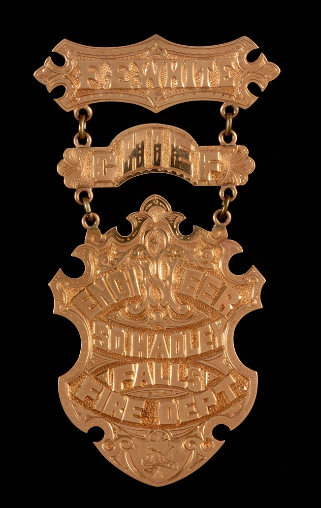LARGE CHIEF ENGINEERS 14K GOLD SUSPENSION BADGE FROM SOUTH HADLEY FALLS FIRE DEPARTMENT. 