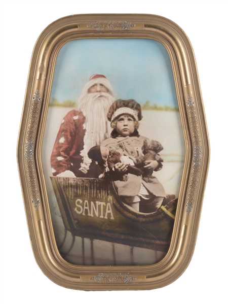 FRAMED TINTED PHOTOGRAPH OF SANTA AND GIRL IN A SLEIGH.