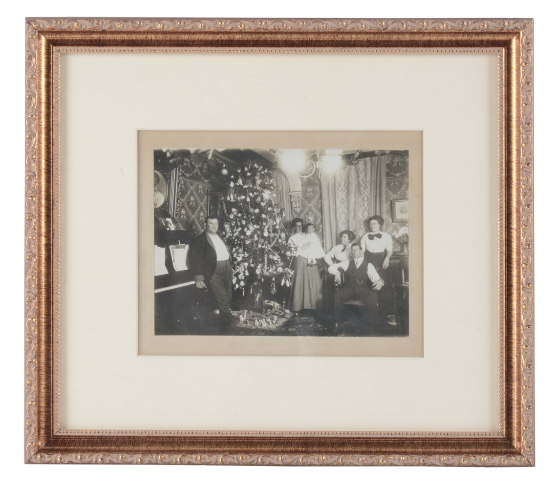 FRAMED FAMILY PORTRAIT WITH CHRISTMAS TREE.