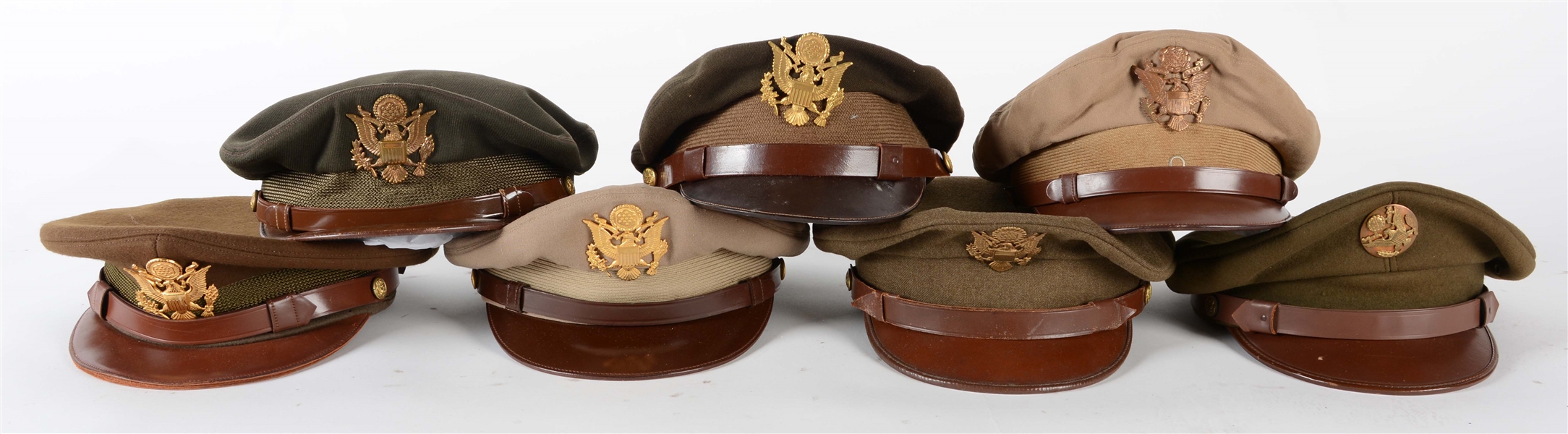 LOT OF 7: WWII US ARMY VISOR CAPS.