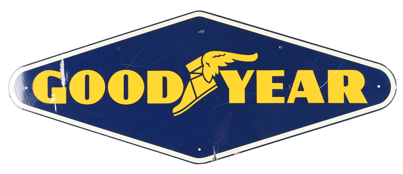 GOODYEAR TIRES DIE CUT TIN SIGN WITH WINGED FOOT GRAPHIC.