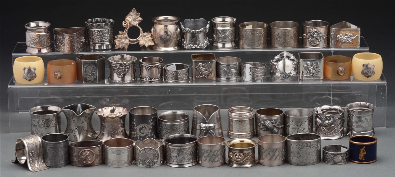 LOT OF OVER 50 SILVER PLATED ANTIQUE NAPKIN RINGS. 