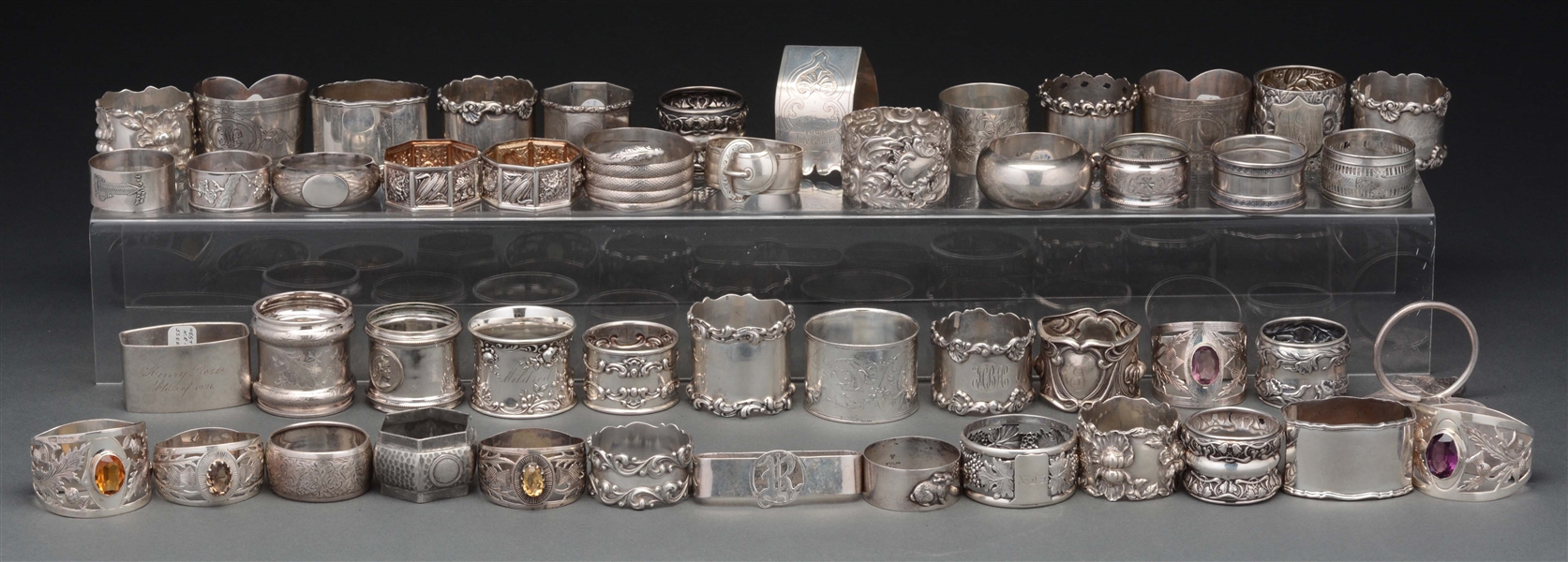 LOT OF OVER 50 STERLING SILVER NAPKIN RINGS. 
