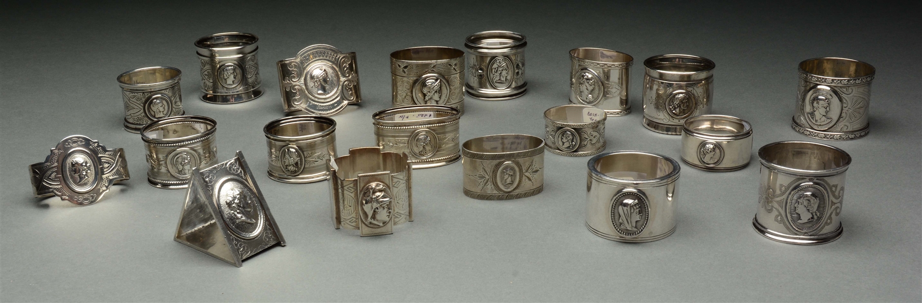 LOT OF 20: COIN MEDALLION SILVER NAPKIN RINGS. 
