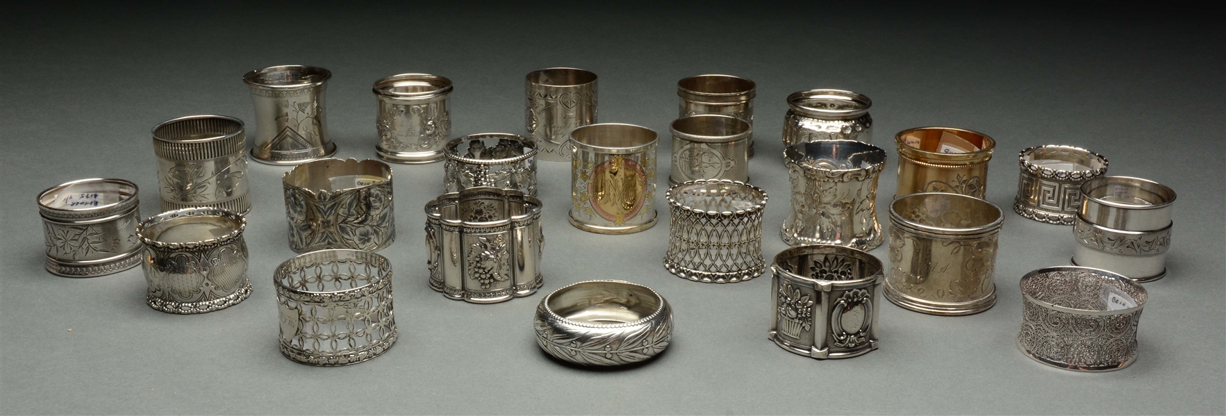 LOT OF 23: COIN SILVER NAPKIN RINGS. 