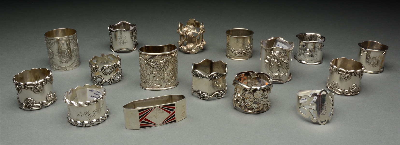 LOT OF 16: STERLING SILVER NAPKIN RINGS. 