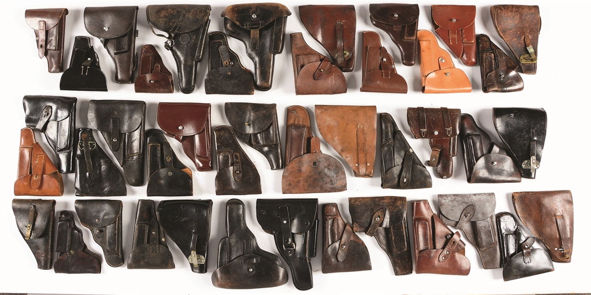 LOT OF 58: ASSORTED EUROPEAN MILITARY HOLSTERS.