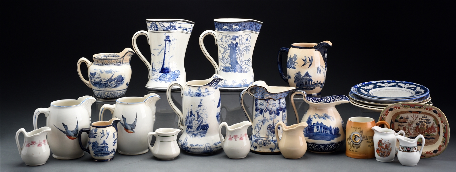 GROUP OF 26: 19TH CENTURY TRANSFER WARE PITCHERS AND CREAMERS. 
