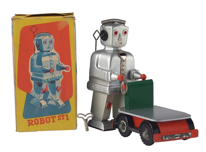 TIN LITHO AND PAINTED WIND UP ROBOT ST-1 WITH CART.