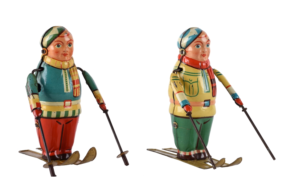 LOT OF 2: TIN LITHO WIND UP SKIERS.