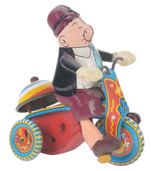 JAPANESE TIN LITHO AND CELLULOID WIND UP WIMPY ON TRICYCLE TOY.