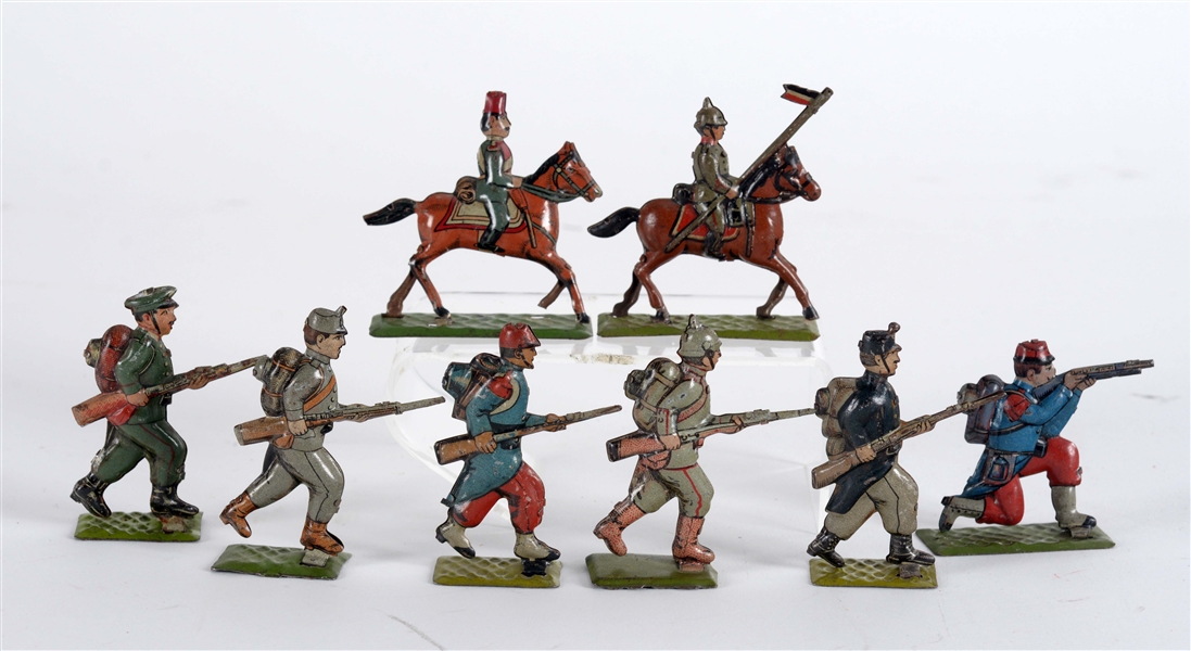 LOT OF 8: PRE-WAR GERMAN TIN LITHO PENNY TOY SOLDIERS.