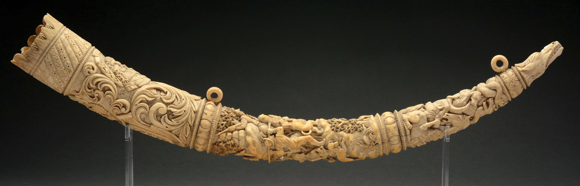 RARE DEEPLY CARVED EUROPEAN IVORY HORN WITH HUNTING ANIMALS.
