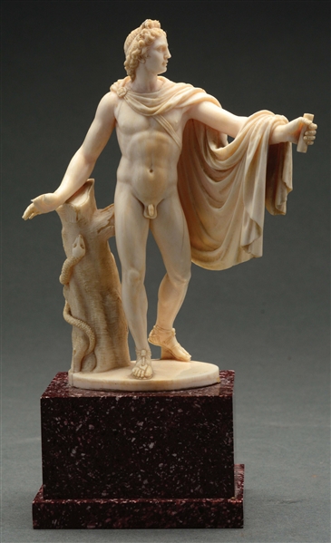 CARVED EUROPEAN IVORY MALE FIGURE ON MARBLE BASE.