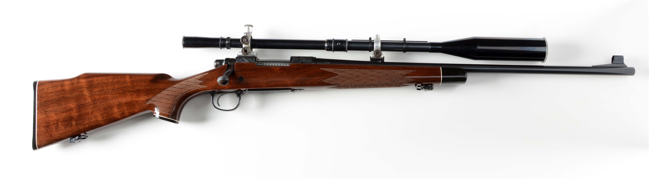 (M) DELUXE ENGRAVED REMINGTON MODEL 700 WITH FECKER SCOPE.