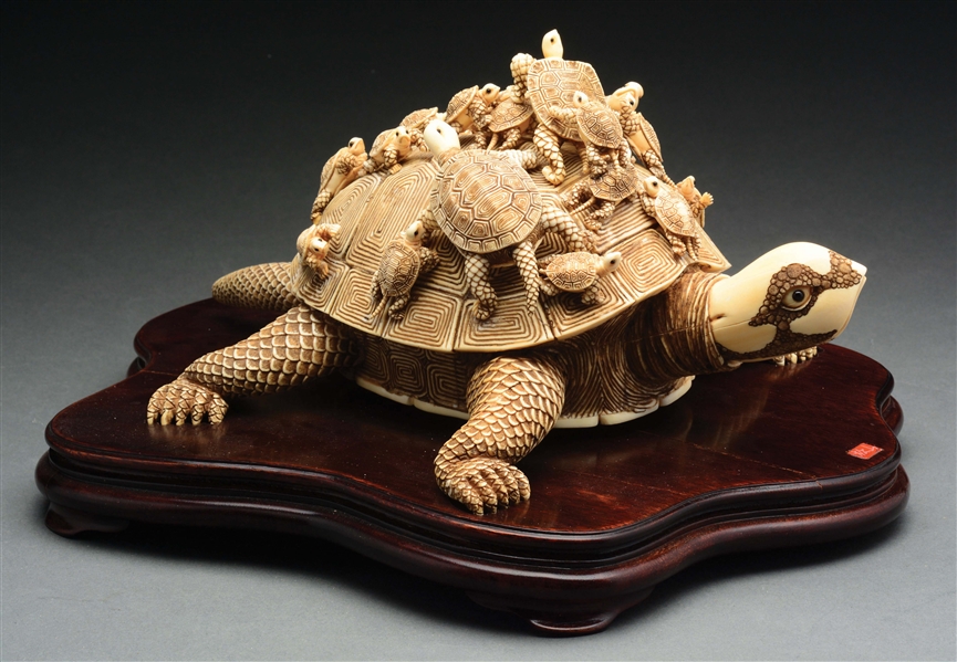 JAPANESE IVORY TURTLE ON A WOODEN PLAQUE.