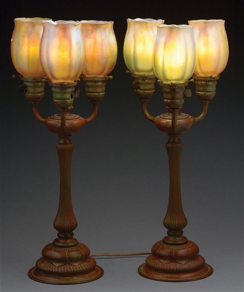 TIFFANY STUDIOS NEWEL POST TABLE LAMPS WITH TULIP SHADES.