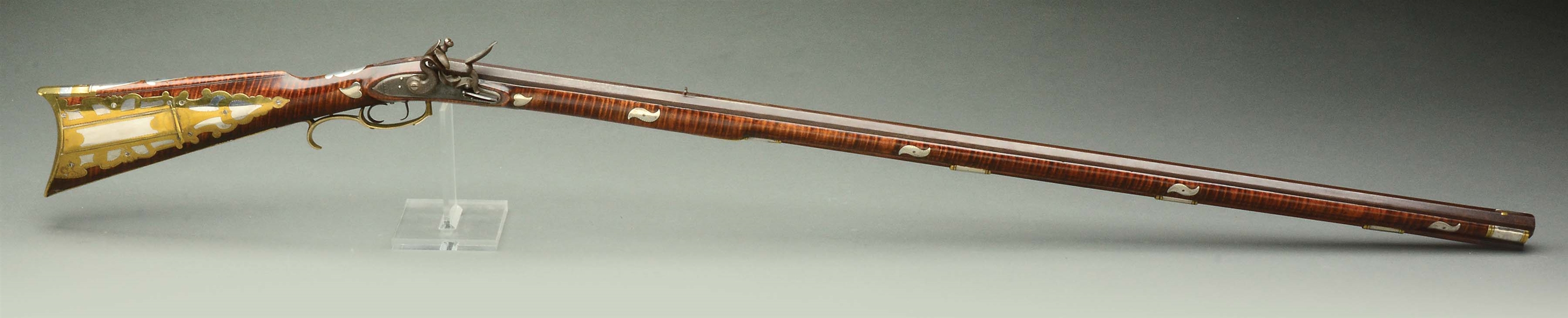 (A) FANTASTIC AND PROFUSELY SILVER INLAID AND PARTIALLY SILVER MOUNTED FLINTLOCK TENNESSEE RIFLE ATTRIBUTED TO THE YOUNG FAMILY.