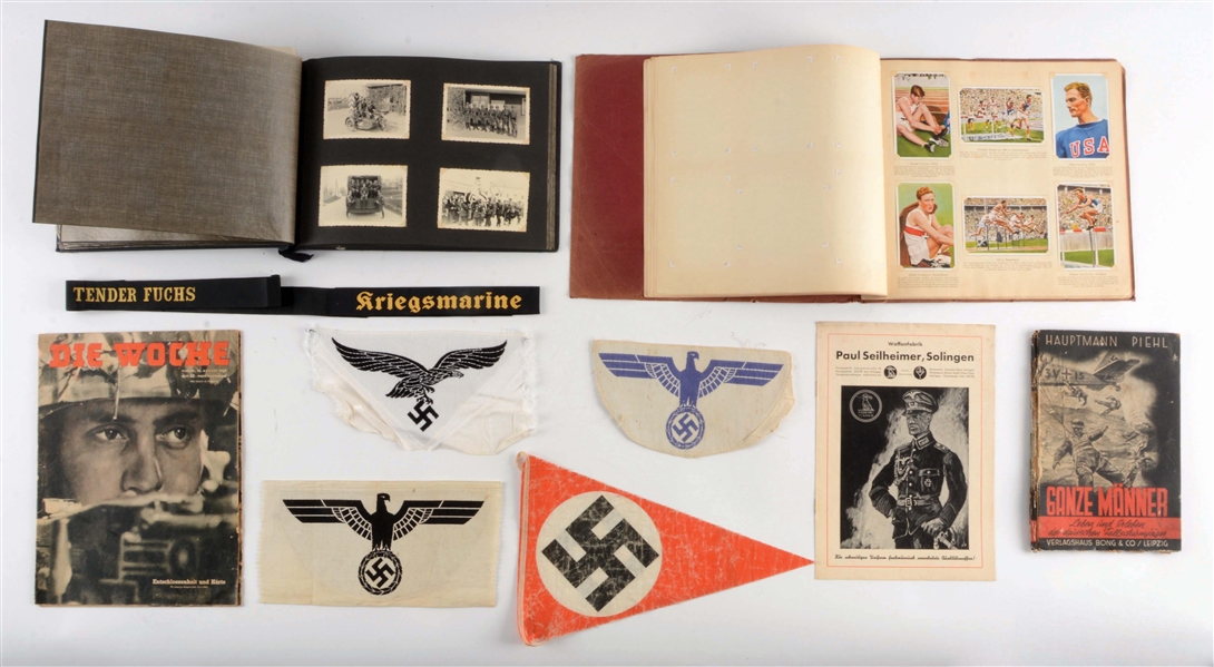 LOT OF 11: GERMAN WORLD WAR II MISCELLANEOUS PAPERWORK, INSIGNIA, AND PHOTO ALBUM