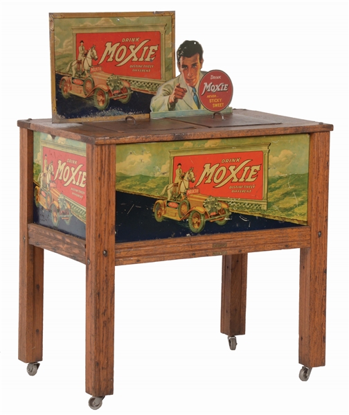 WOODEN MOXIE COOLER WITH SIGNS.