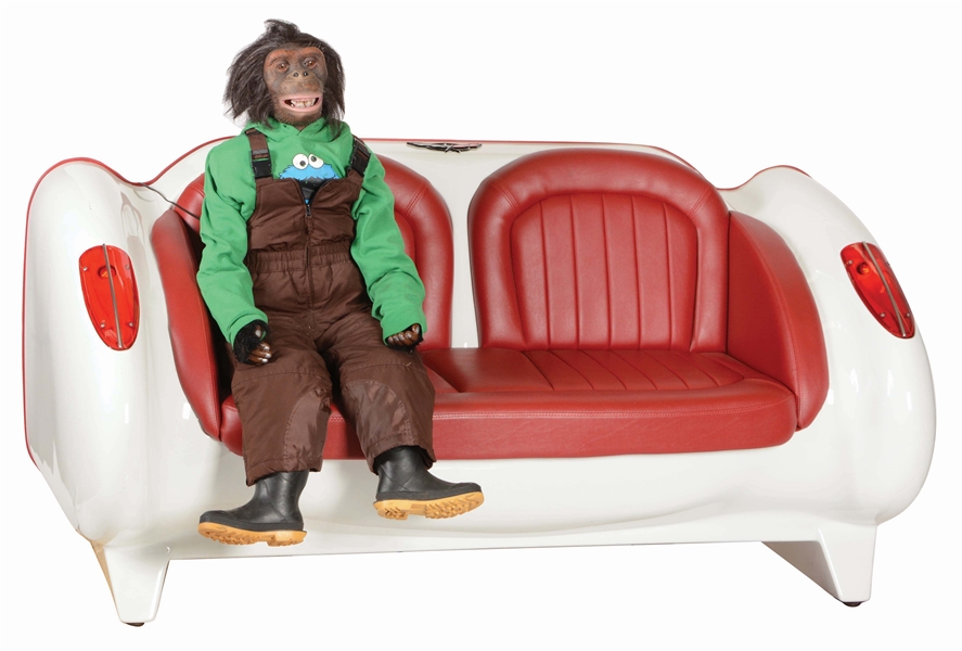 LOT OF 2: CORVETTE LOVE SEAT AND RADIO-CONTROLLED MECHANICAL MONKEY.