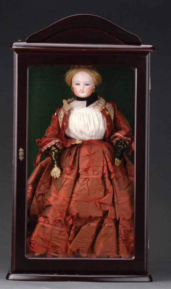 FRENCH FASHION DOLL IN WOODEN GLASS-FRONTED DISPLAY CASE.