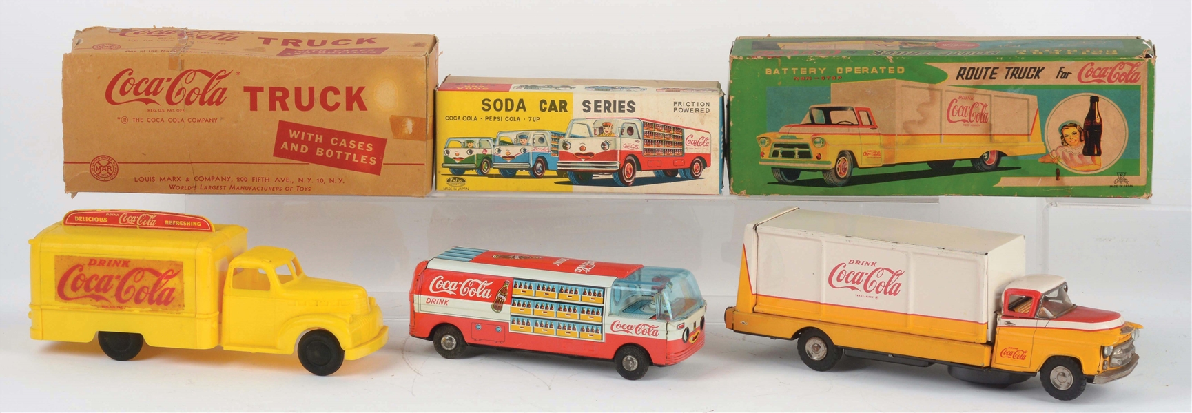 LOT OF 3: JAPANESE AND AMERICAN MADE COCA-COLA TOY TRUCKS.