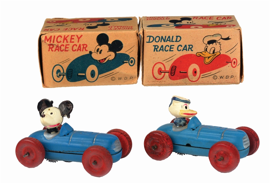 LOT OF 2: JAPANESE TIN-LITHO AND CELLULOID WALT DISNEY MICKEY MOUSE AND DONALD DUCK RACE CAR TOYS IN ORIGINAL BOXES.