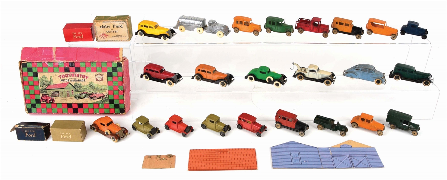 NICE LOT OF APPROXIMATELY 20 EARLY TOOTSIE TOYS AND OTHER SLUSH MOLD VEHICLES.