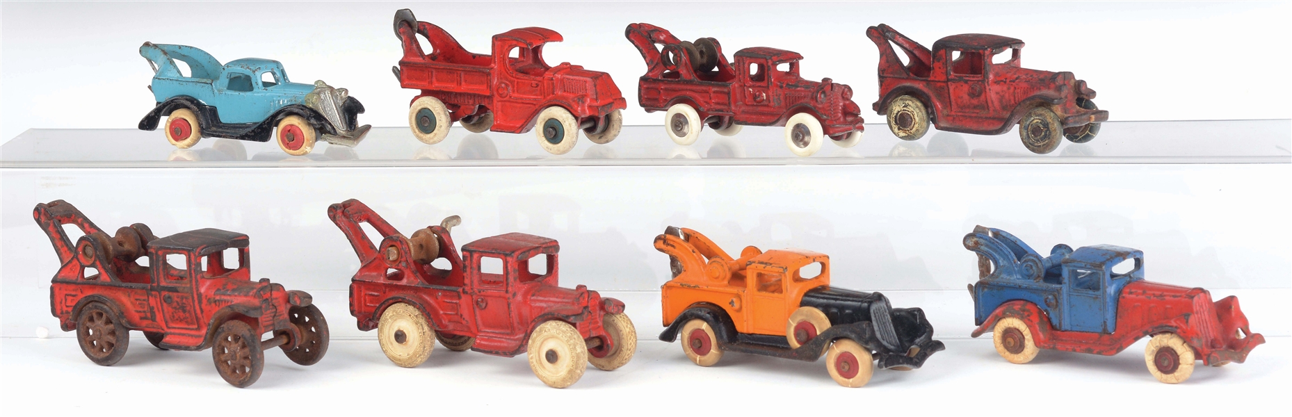 LOT OF 8: CAST-IRON AMERICAN MADE TOW TRUCKS.