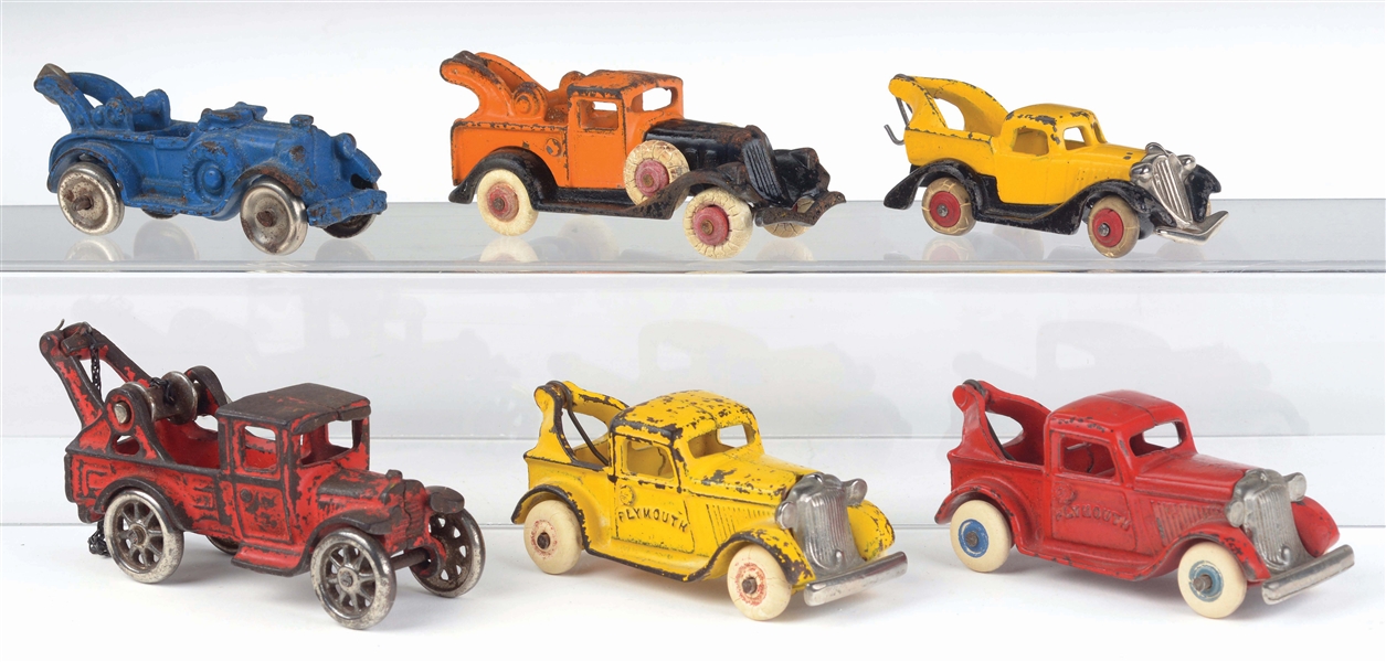 LOT OF 6: CAST-IRON AMERICAN MADE TOW TRUCKS.