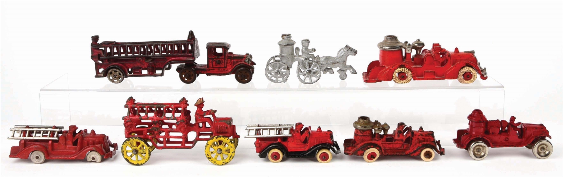 LOT OF 8: AMERICAN MADE CAST-IRON FIRE LADDER AND PUMPER TRUCKS. 