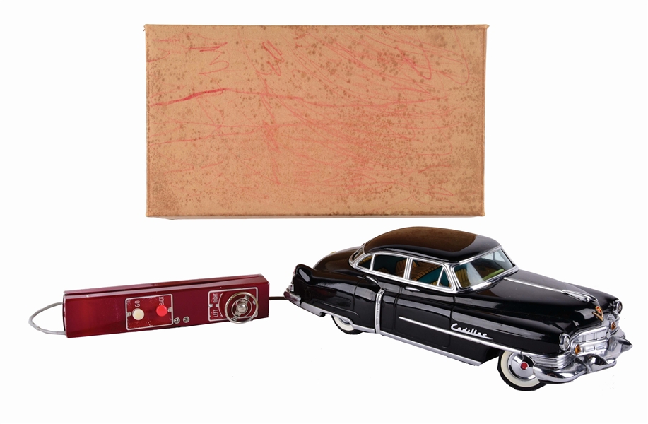 UNUSUAL VERSION OF JAPANESE MARUSAN TIN-LITHO 1954 CADILLAC WITH REMOTE CONTROL AND ORIGINAL BOX.