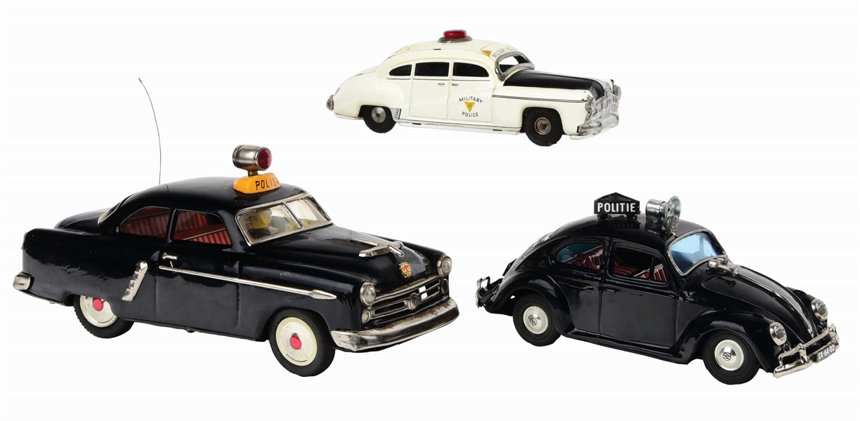 LOT OF 3: JAPANESE AND GERMAN TIN-LITHO FRICTION AND BATTERY-OPERATED POLICE VEHICLES.