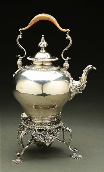AN ENGLISH SILVER KETTLE ON STAND.