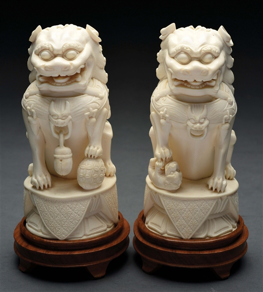 PAIR OF IVORY CARVED FOO DOGS