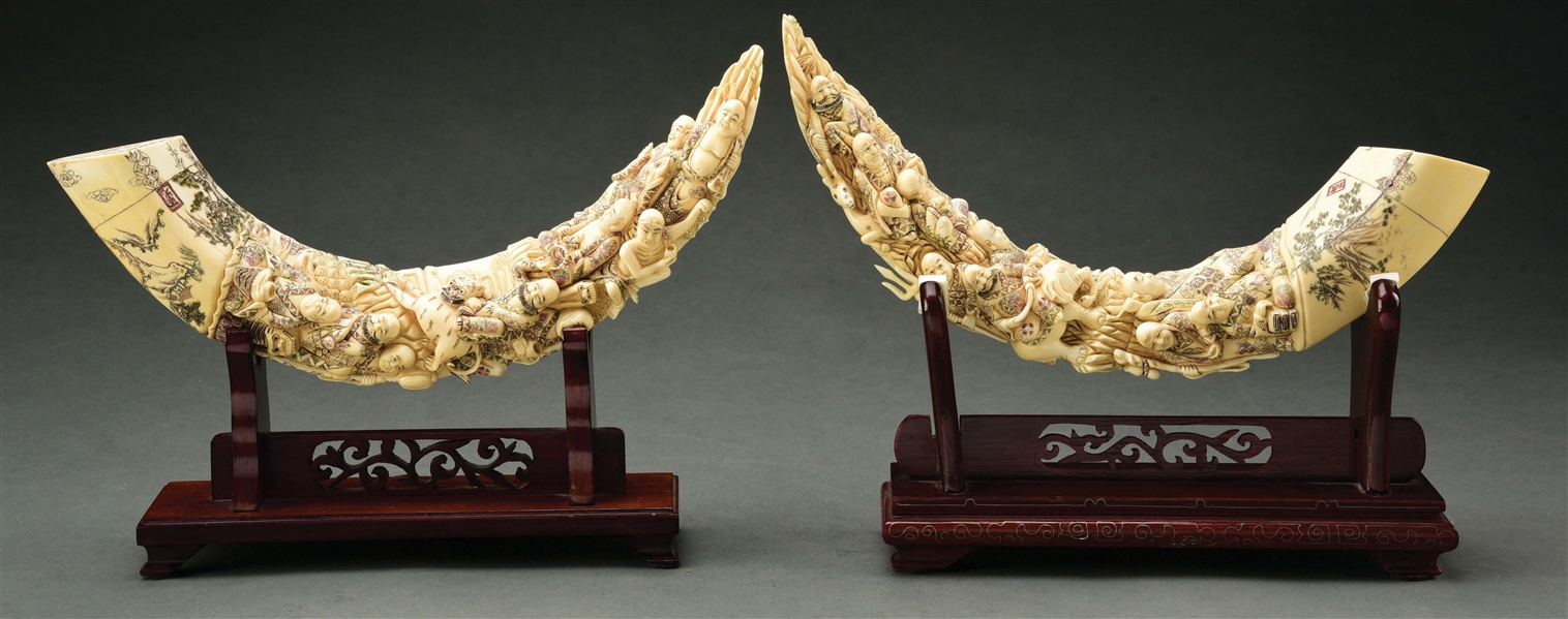 PAIR OF CARVED IVORY TUSKS.
