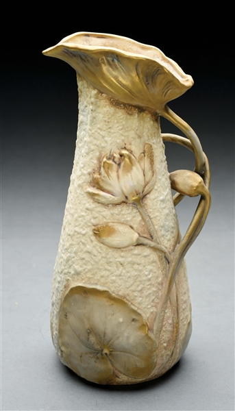 AMPHORA PITCHER WITH RAISED FLOWERS.