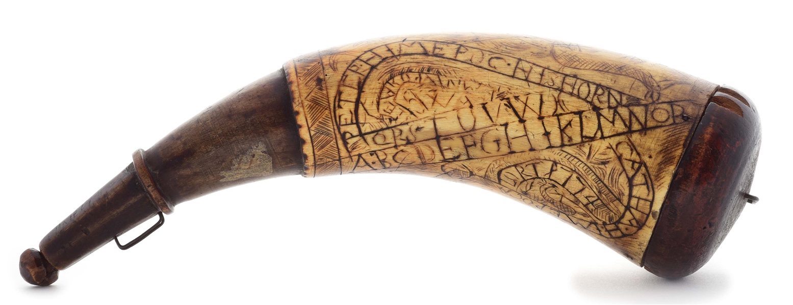 ENGRAVED POWDER HORN INSCRIBED WITH THE ALPHABET, DATED 1774.