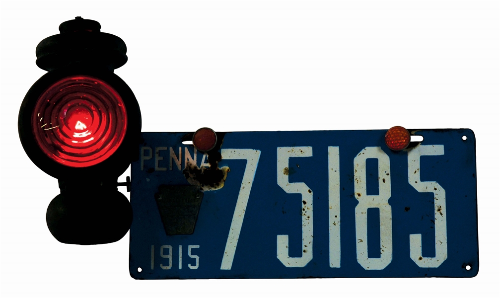 PENNSYLVANIA 1915 PORCELAIN LICENSE PLATE W/ REAR BRAKE LIGHT LANTERN.