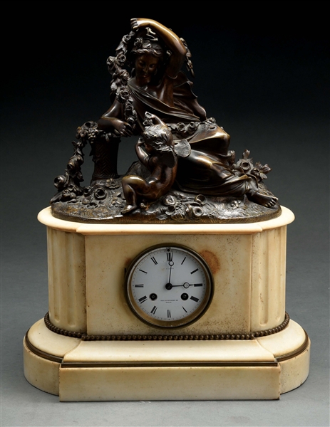 MARBLE MANTLE CLOCK WITH BRONZE FIGURINE.