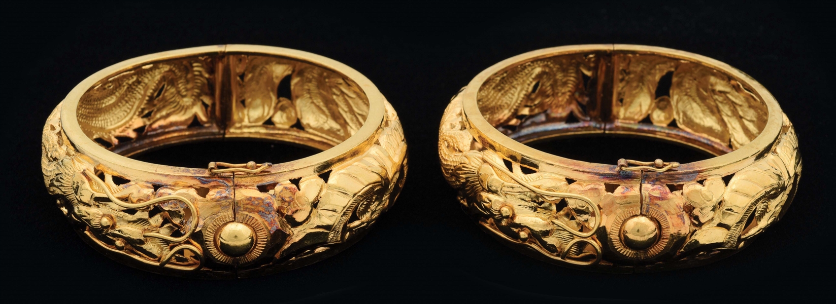 PAIR OF MATCHING WIDE YELLOW GOLD CHINESE BANGLE BRACELETS.