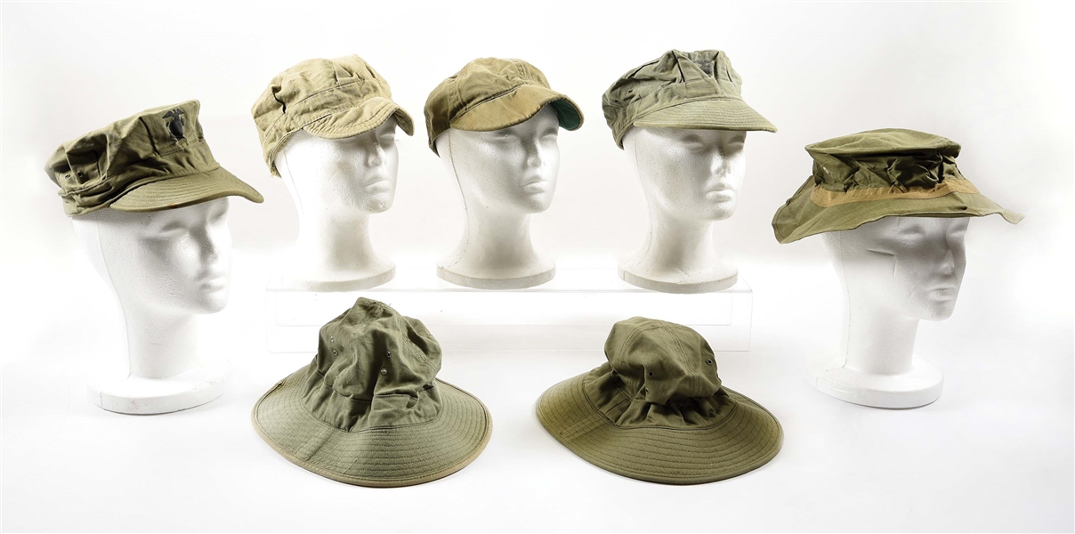 LOT OF 7: WORLD WAR II USMC RAIN HAT, FATIGUE HATS, AND DAISY MAE HATS.