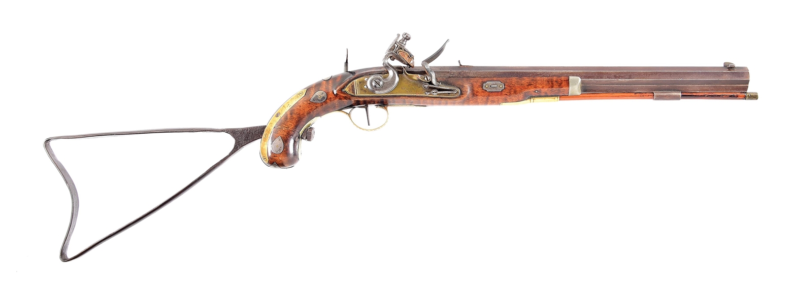 (A) SCARCE AND ATTRACTIVE FLINTLOCK KENTUCKY TARGET PISTOL WITH IRON STOCK AND BRASS LOCK.