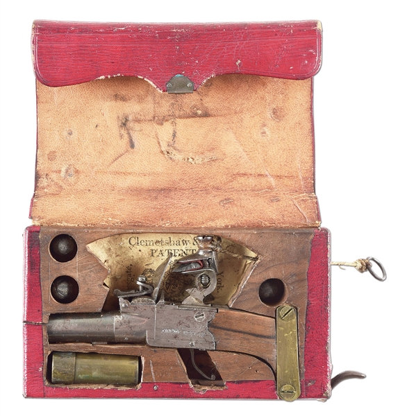 (A) RARE ENGLISH 19TH CENTURY CLEMETSHAW PATENT MORROCAN LEATHER WALLET WITH HIDDEN PISTOL.